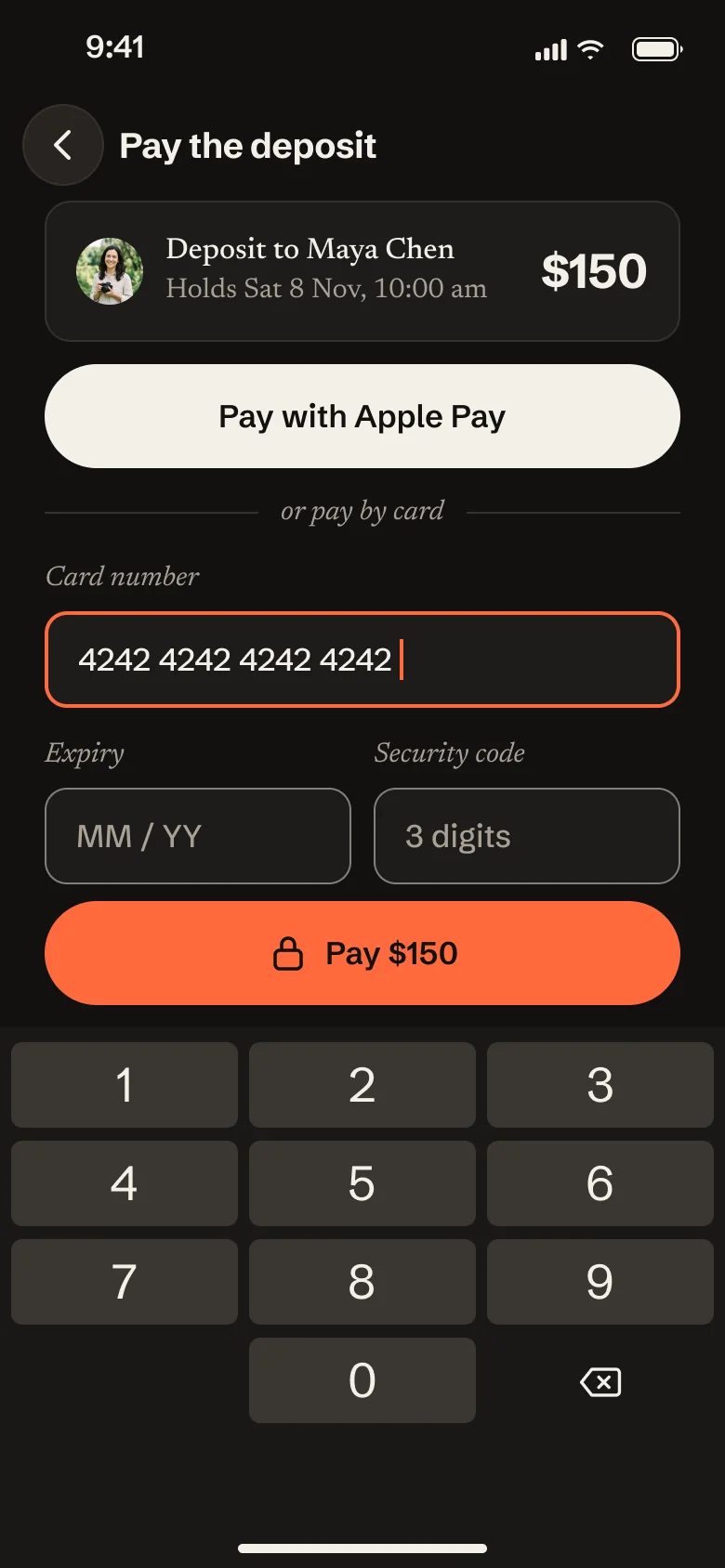 The payment screen in the dark theme, with Apple Pay, the card fields and the orange Pay $150 button.